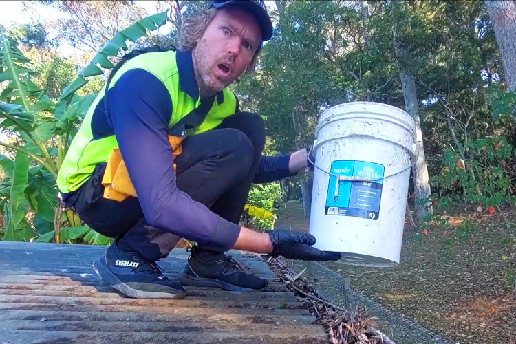 wollongong Gutter cleaning highlights the significance of a bucket during the process.